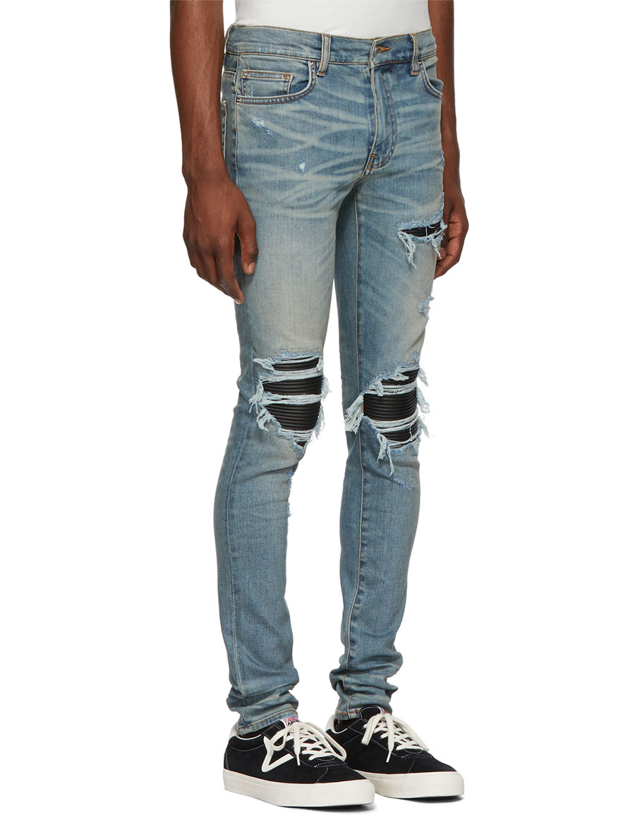 black amiri jeans with patches